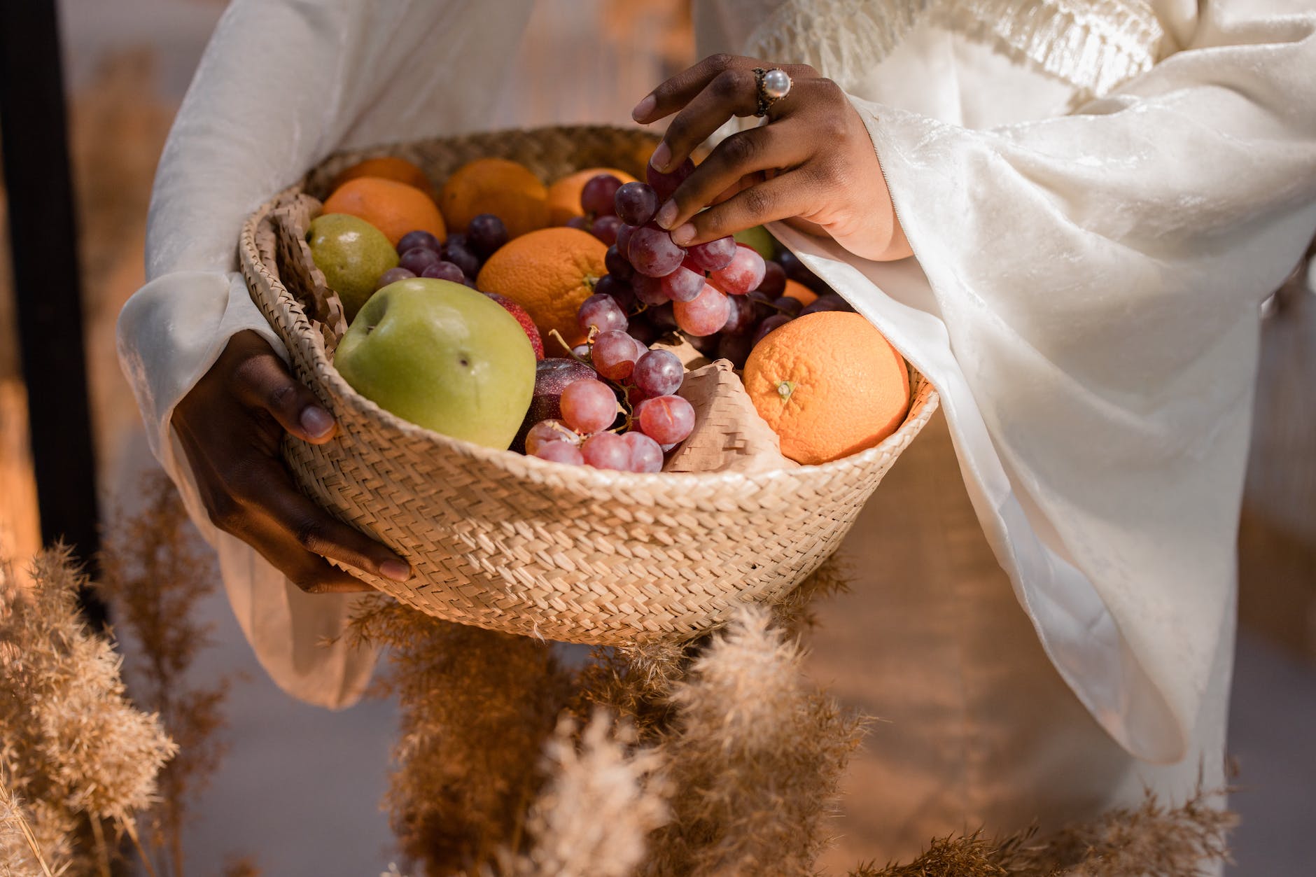assorted fruits on a woven basket